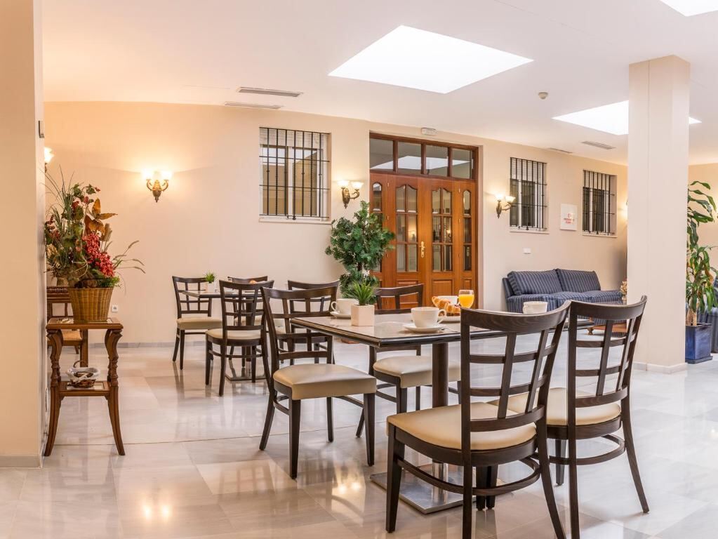 Shared lounge and seating area at Hotel Gran Avenida